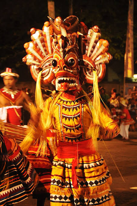 Yaka mask dancer - ceremonial procession